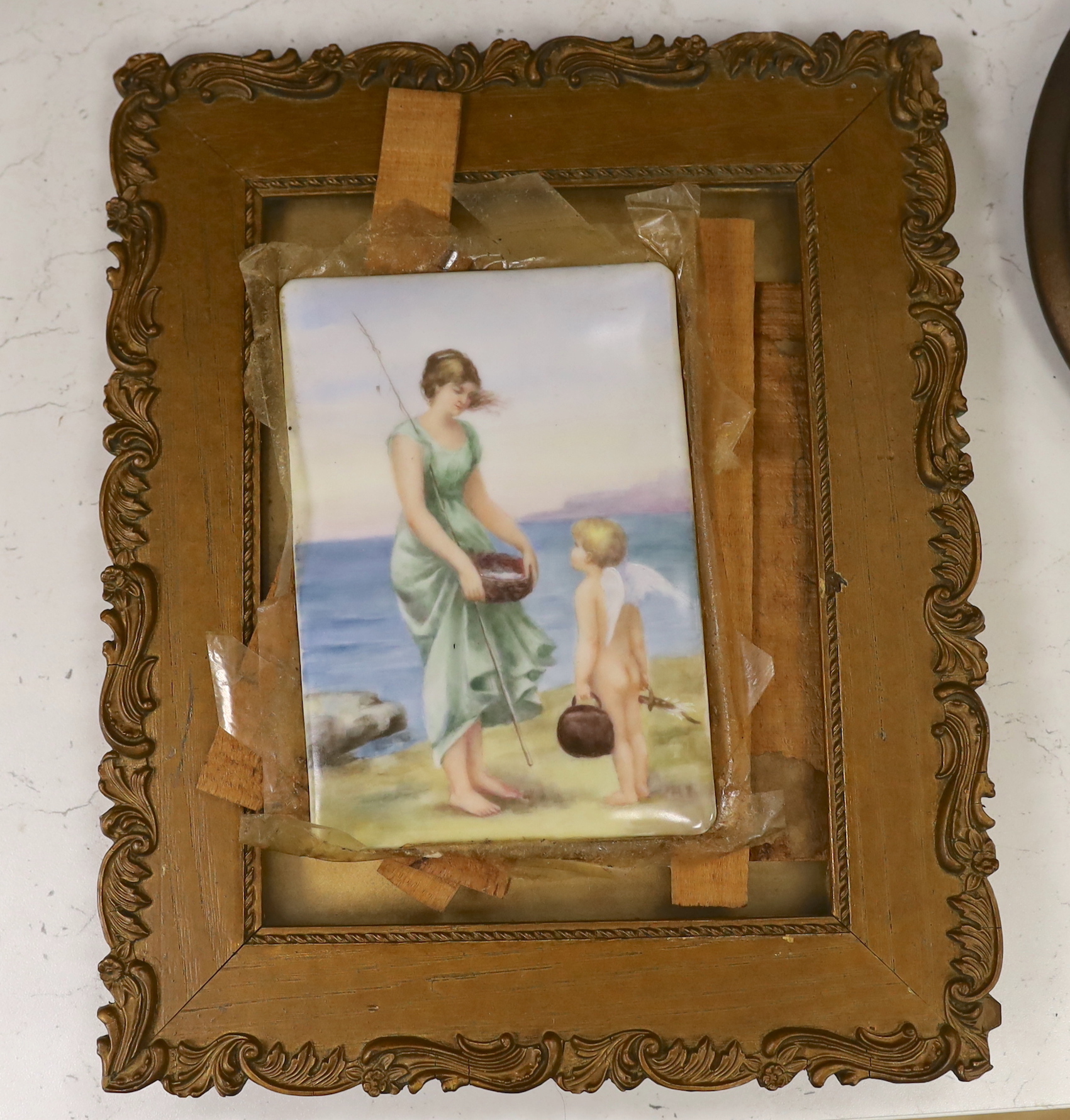 A Continental porcelain plaque painted with a woman and putti on a beach, 17 x 12cm
